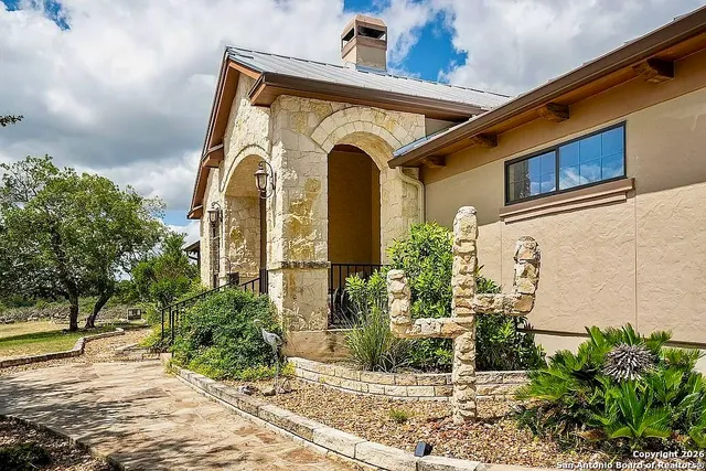 a front view of a house with garden