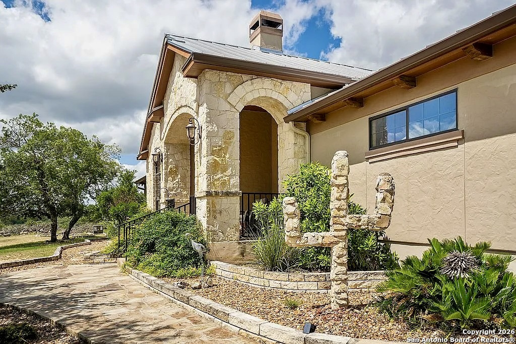 a front view of a house with garden
