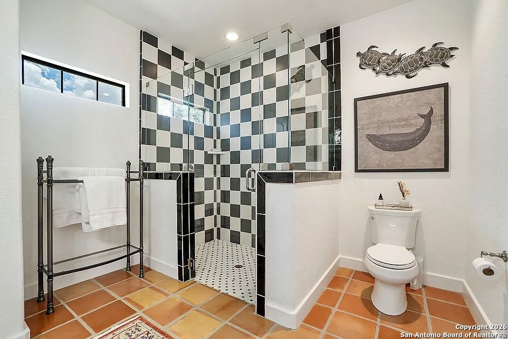 1112 Kendall Jackson Comfort, TX 78013 - Photo 25 of 32 a bathroom with a toilet and a shower