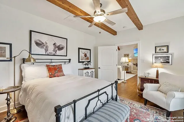 a bed room with furniture and a chandelier