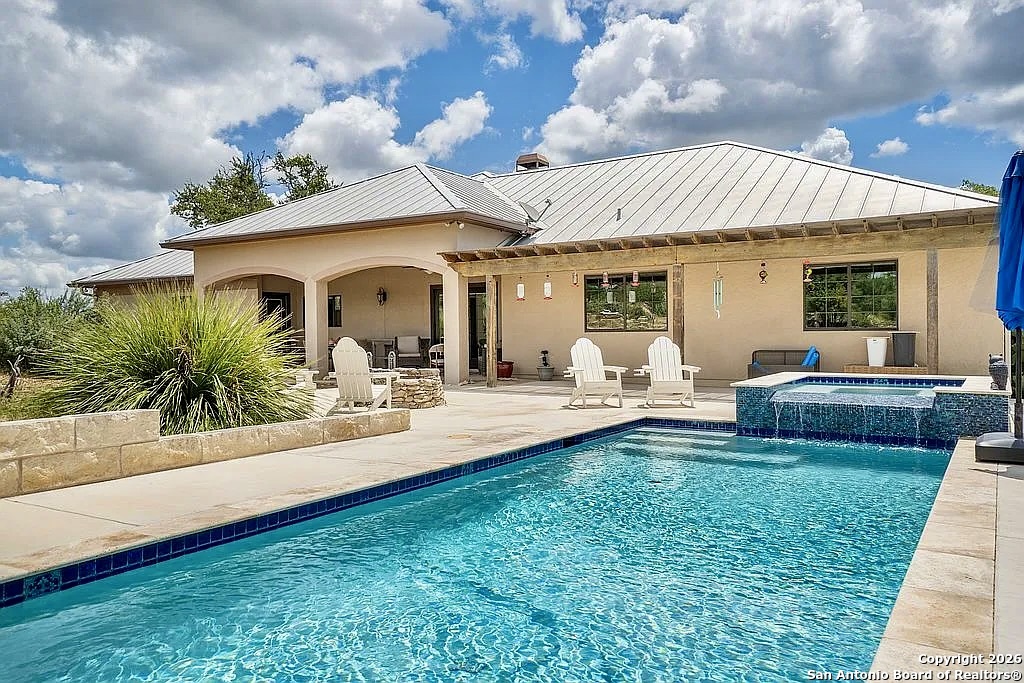 1112 Kendall Jackson Comfort, TX 78013 - Photo 3 of 32 a front view of a house with garden and patio