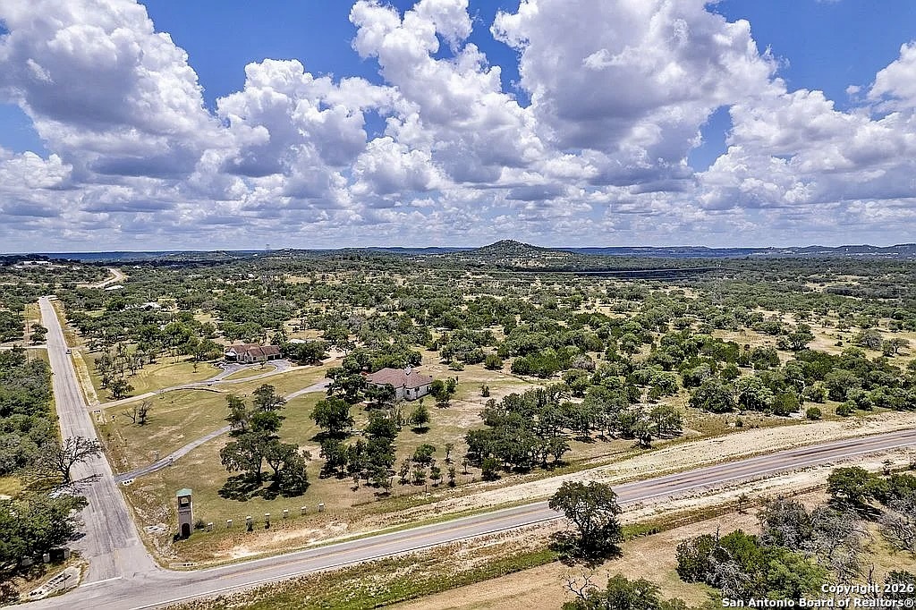1112 Kendall Jackson Comfort, TX 78013 - Photo 32 of 32 a view of a lake with a building in the background