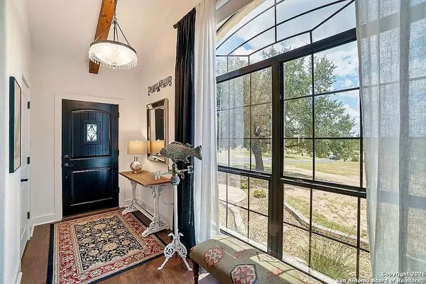 a view of a hallway with living room and dining room view
