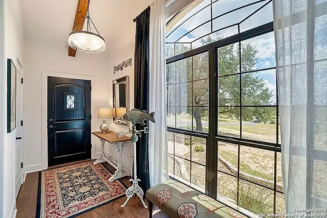 a view of a hallway with living room and dining room view