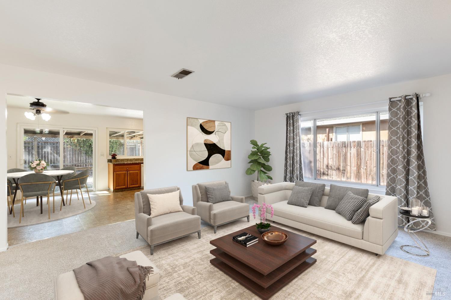 19243 Robinson Road Sonoma, CA 95476 - Photo 1 of 1 a living room with furniture a rug and a large window