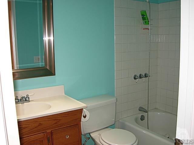 2120 Outsail Lane Oxnard, CA 93035 - Photo 13 of 24 a bathroom with a sink a toilet and shower