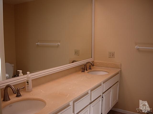 2120 Outsail Lane Oxnard, CA 93035 - Photo 15 of 24 a bathroom with a sink and a mirror