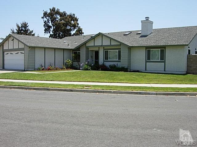 2120 Outsail Lane Oxnard, CA 93035 - Photo 24 of 24 a front view of a house with a yard