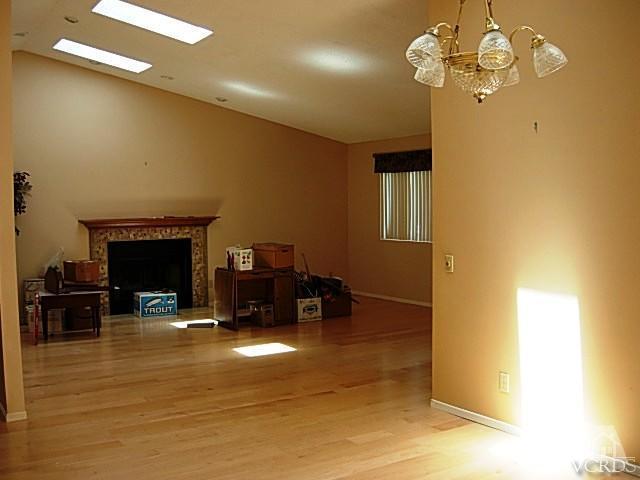 2120 Outsail Lane Oxnard, CA 93035 - Photo 7 of 24 a living room with furniture and a fireplace