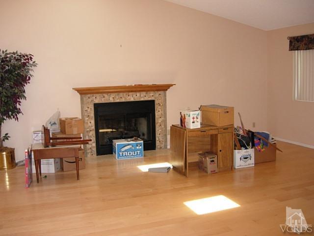2120 Outsail Lane Oxnard, CA 93035 - Photo 8 of 24 a living room with furniture and a fireplace
