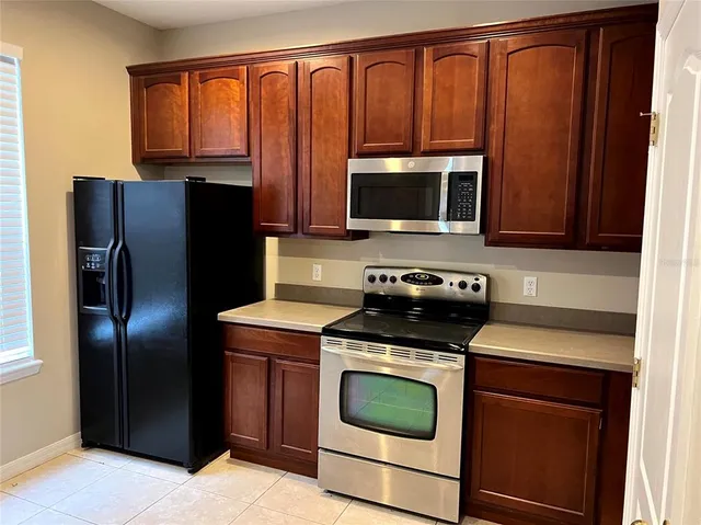 a kitchen with a stove microwave and refrigerator