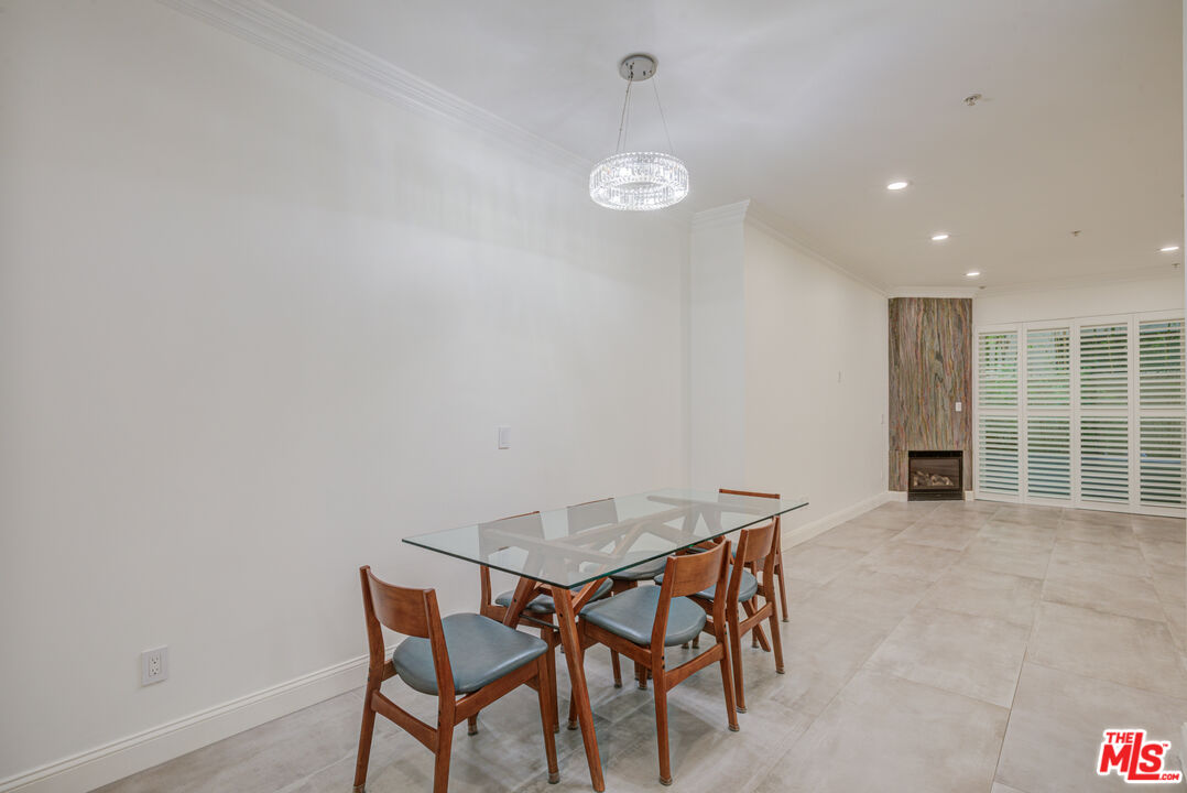 1444 South Point View Street, Unit 103 Los Angeles, CA 90035 - Photo 14 of 44 a view of a room with furniture and wooden floor