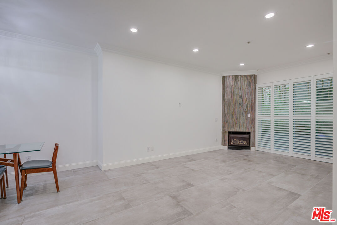 1444 South Point View Street, Unit 103 Los Angeles, CA 90035 - Photo 15 of 44 an empty room with windows