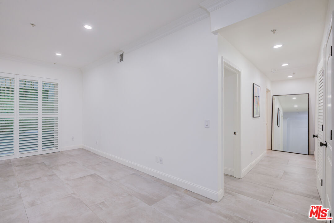 1444 South Point View Street, Unit 103 Los Angeles, CA 90035 - Photo 19 of 44 an empty room with windows