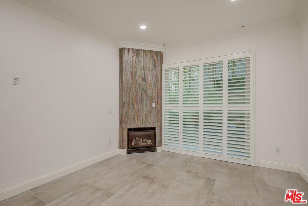 1444 South Point View Street, Unit 103 Los Angeles, CA 90035 - Photo 22 of 44 a view of an empty room with a window