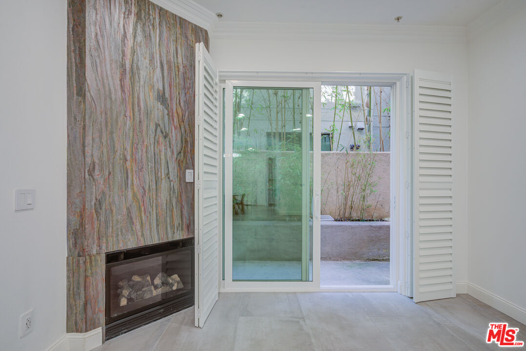 1444 South Point View Street, Unit 103 Los Angeles, CA 90035 - Photo 23 of 44 a view of a room that has a bed in it