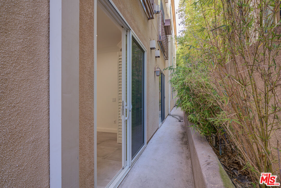 1444 South Point View Street, Unit 103 Los Angeles, CA 90035 - Photo 25 of 44 a view of a pathway both side of house