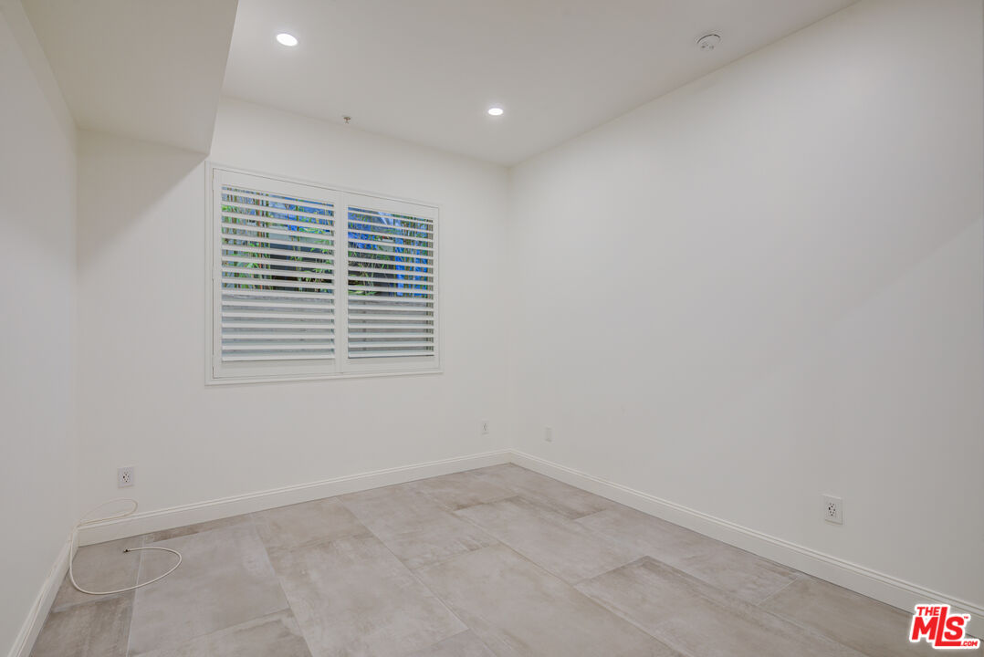 1444 South Point View Street, Unit 103 Los Angeles, CA 90035 - Photo 34 of 44 an empty room with a window