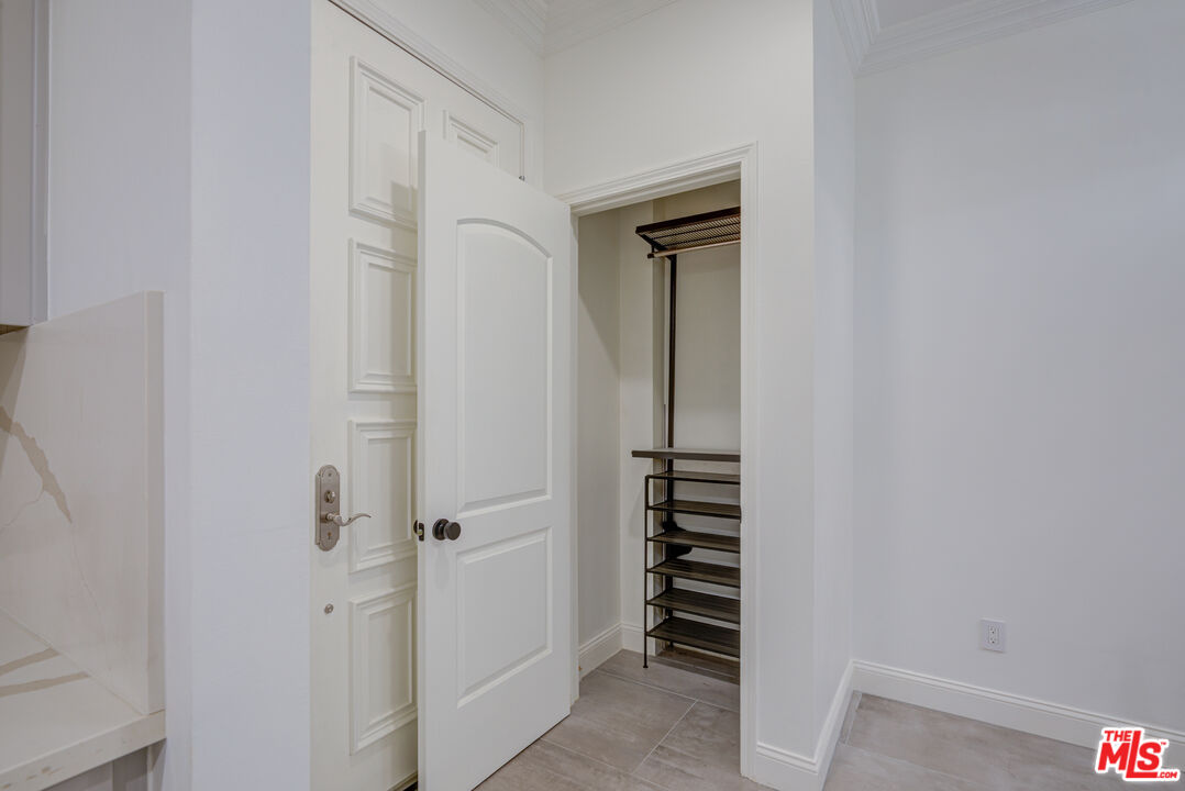1444 South Point View Street, Unit 103 Los Angeles, CA 90035 - Photo 37 of 44 a view of a bathroom with a sink