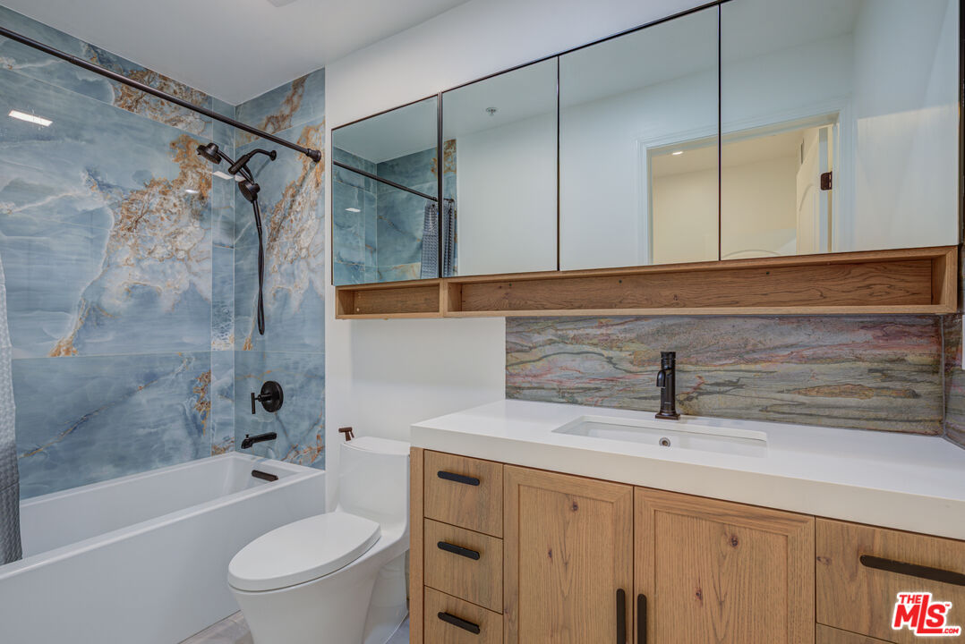 1444 South Point View Street, Unit 103 Los Angeles, CA 90035 - Photo 40 of 44 a bathroom with a sink a toilet and shower