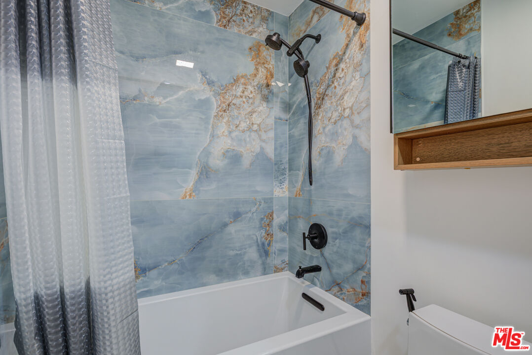 1444 South Point View Street, Unit 103 Los Angeles, CA 90035 - Photo 41 of 44 a bathroom with a bathtub