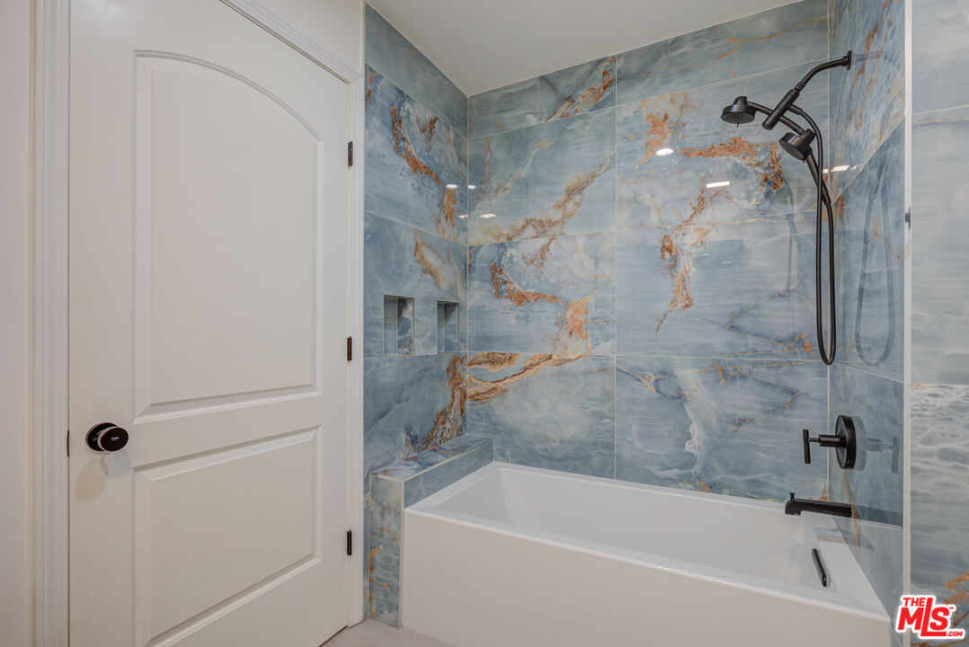 1444 South Point View Street, Unit 103 Los Angeles, CA 90035 - Photo 43 of 44 a bathroom with a bathtub