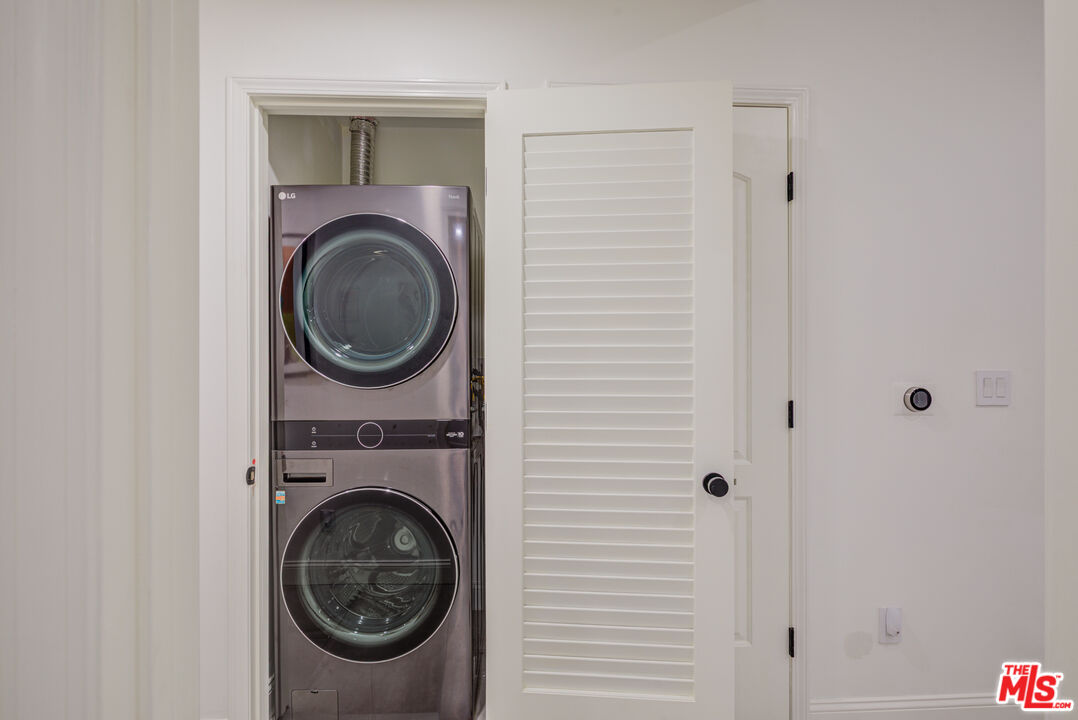 1444 South Point View Street, Unit 103 Los Angeles, CA 90035 - Photo 44 of 44 a utility room with dryer and washer