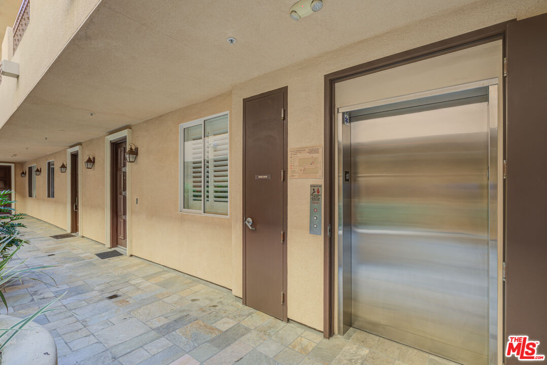 1444 South Point View Street, Unit 103 Los Angeles, CA 90035 - Photo 10 of 44 a view of livingroom with a hallway