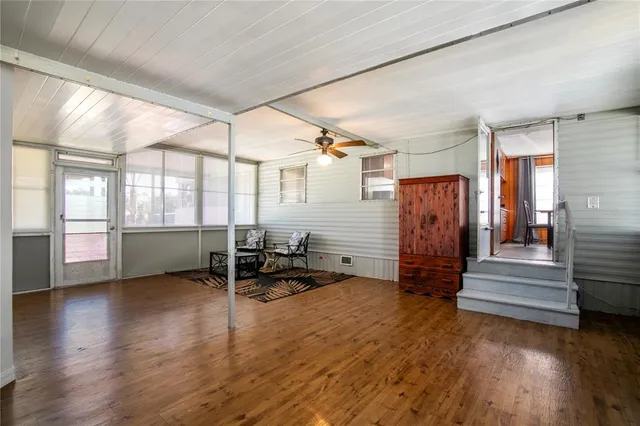 a view of an entryway with wooden floor