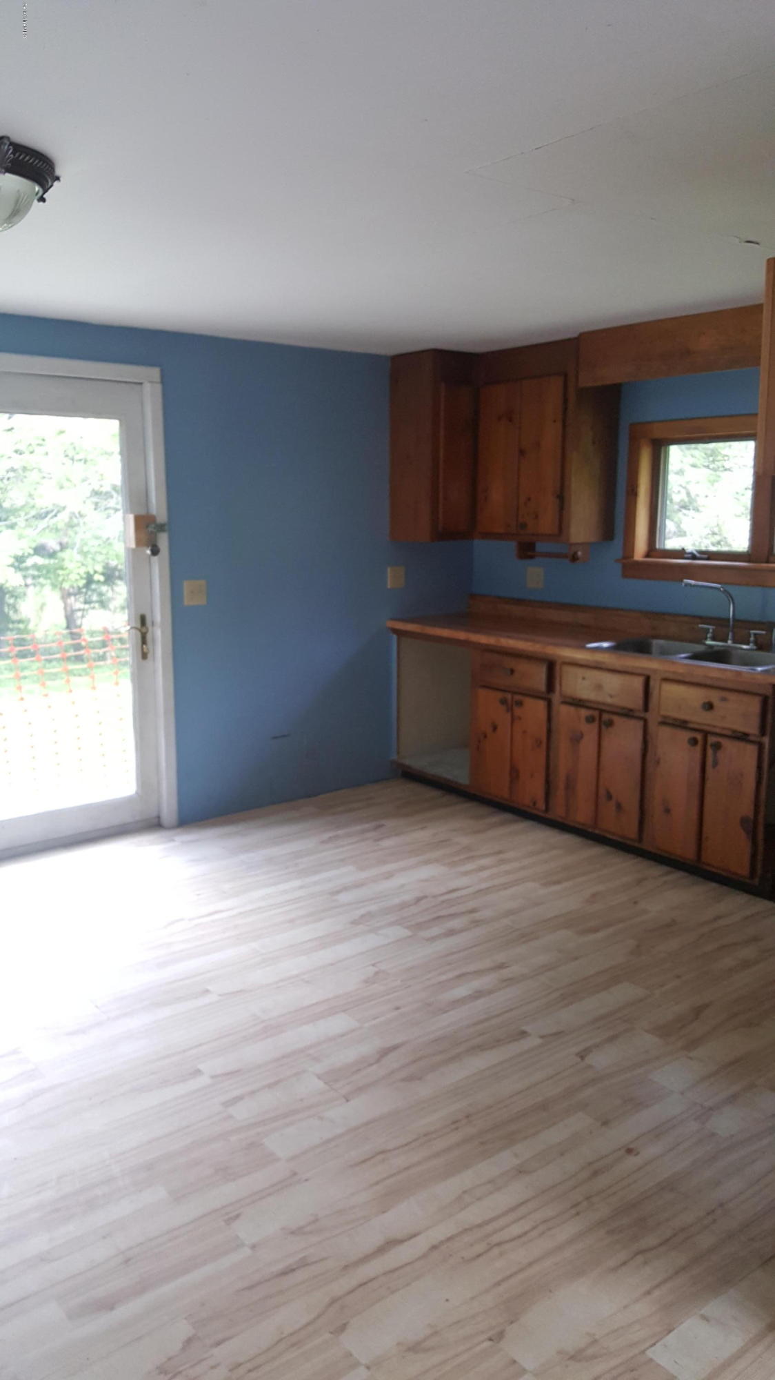 13 Kreutzer Road Peru, MA 01235 - Photo 11 of 21 a room with wooden floors and windows