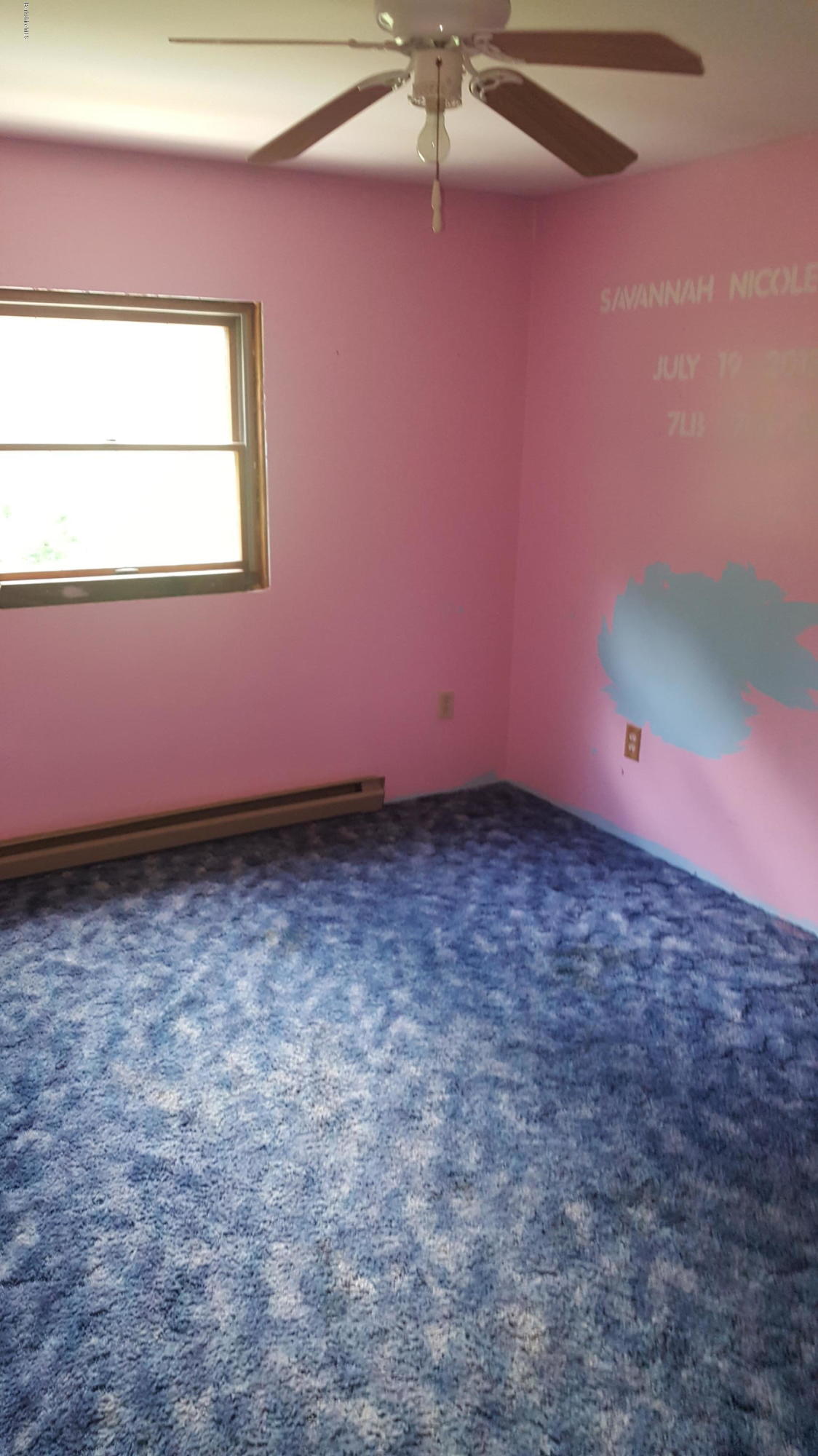 13 Kreutzer Road Peru, MA 01235 - Photo 16 of 21 an empty room with a ceiling fan and a window