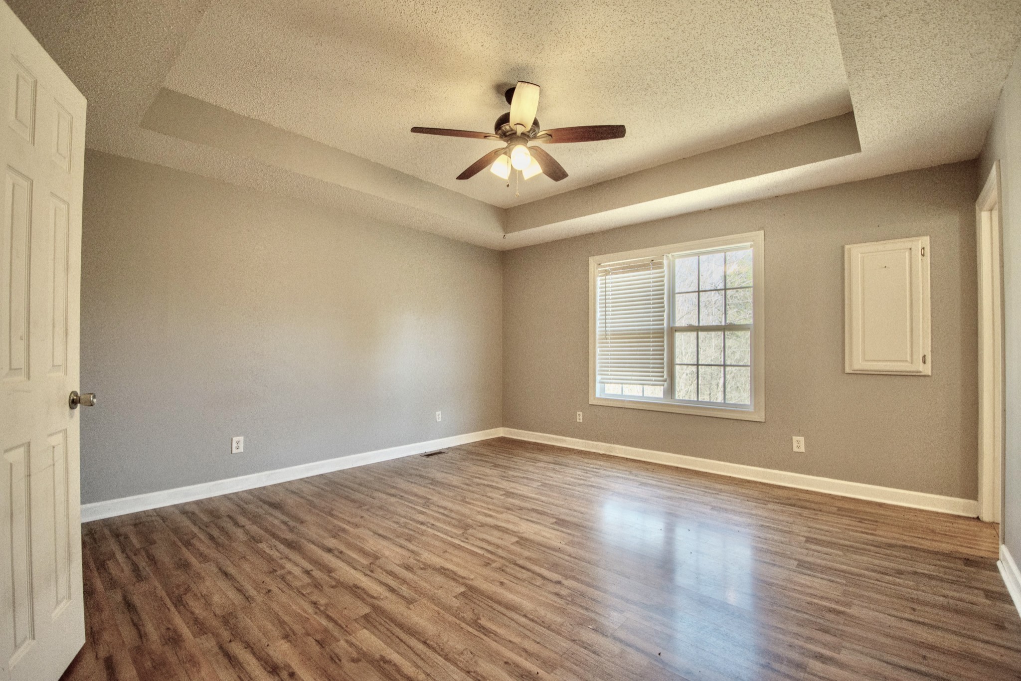 1149 Oak Grove Road Goodspring, TN 38460 - Photo 12 of 21 a view of an empty room with wooden floor and a window