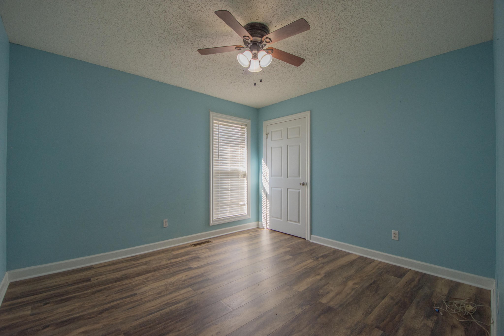 1149 Oak Grove Road Goodspring, TN 38460 - Photo 15 of 21 a view of an empty room with window and a chandelier fan