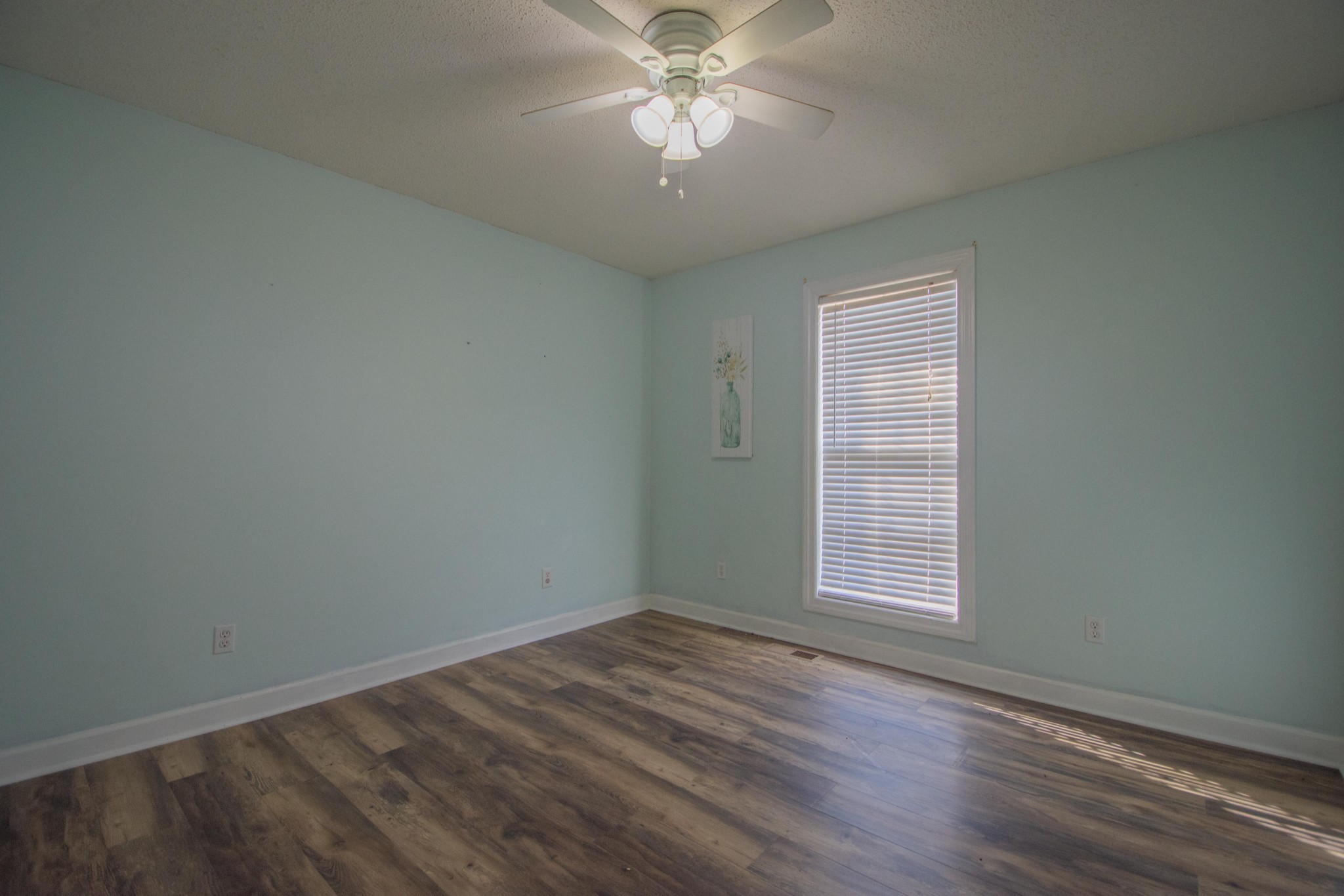1149 Oak Grove Road Goodspring, TN 38460 - Photo 16 of 21 an empty room with a window and a fan