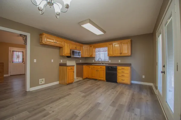 a view of kitchen with wooden floor