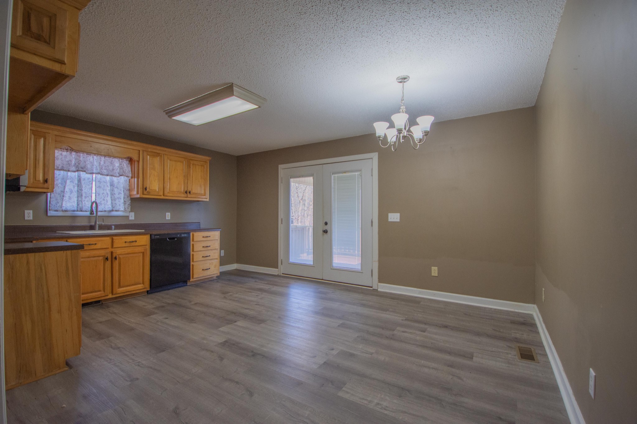 1149 Oak Grove Road Goodspring, TN 38460 - Photo 9 of 21 a view of an empty room with window and wooden floor