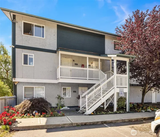 a front view of house along with street view