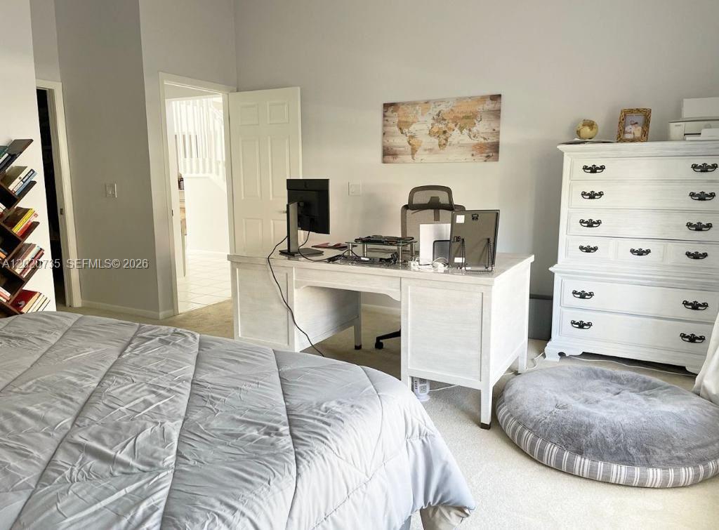 17244 Balboa Point Way Boca Raton, FL 33487 - Photo 36 of 66 a bedroom with a bed and a television