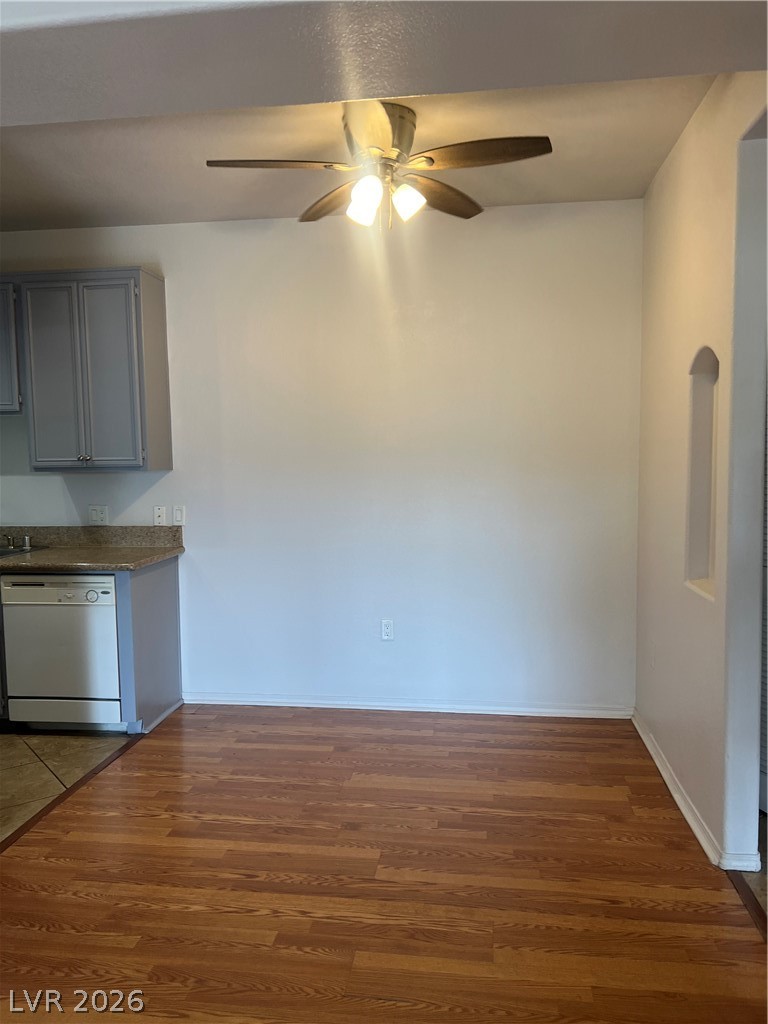 3318 North Decatur Boulevard, Unit 1174 Las Vegas, NV 89130 - Photo 7 of 23 This living space features warm wood flooring and a modern ceiling fan for comfort.
