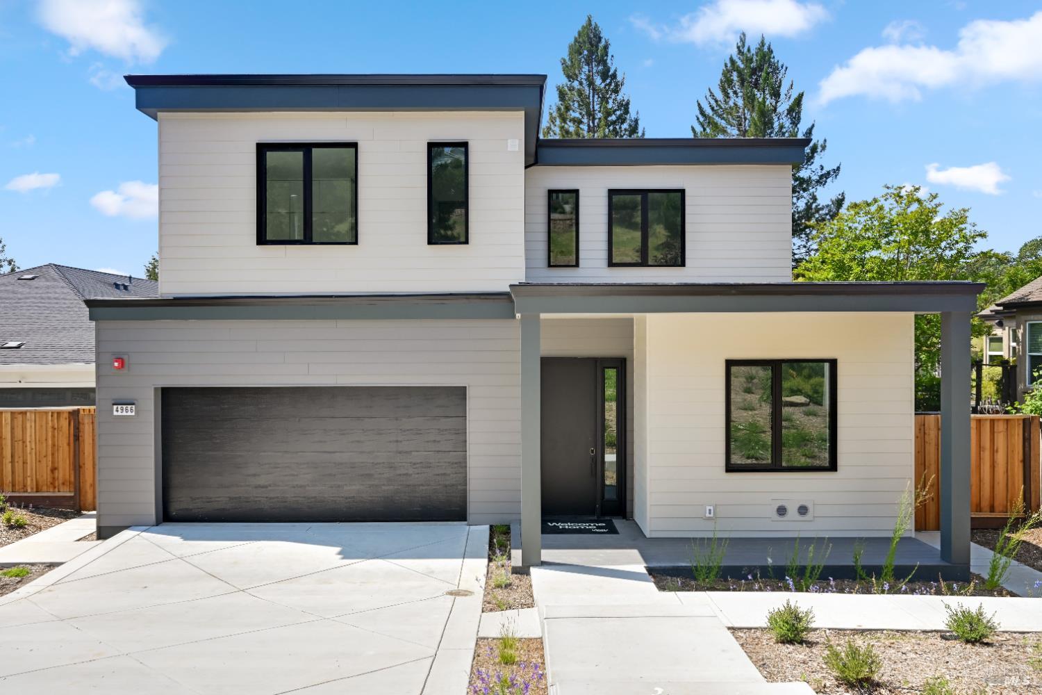 4966 Lakepointe Circle Santa Rosa, CA 95403 - Photo 1 of 1 a front view of a house with garage