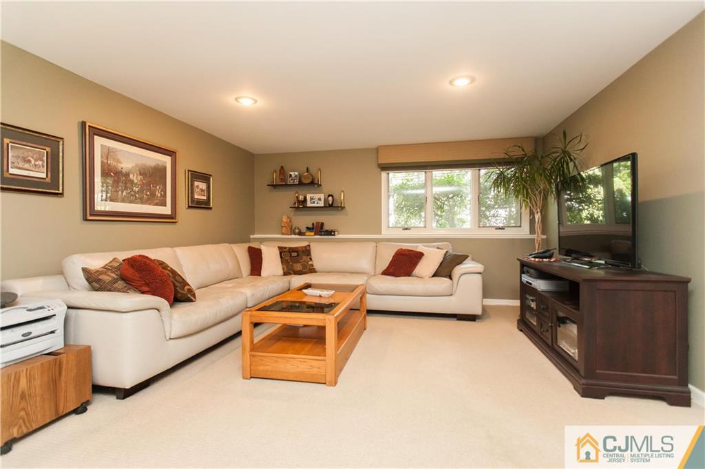 18 Huntington Road Edison, NJ 08820 - Photo 14 of 21 a living room with furniture and a flat screen tv