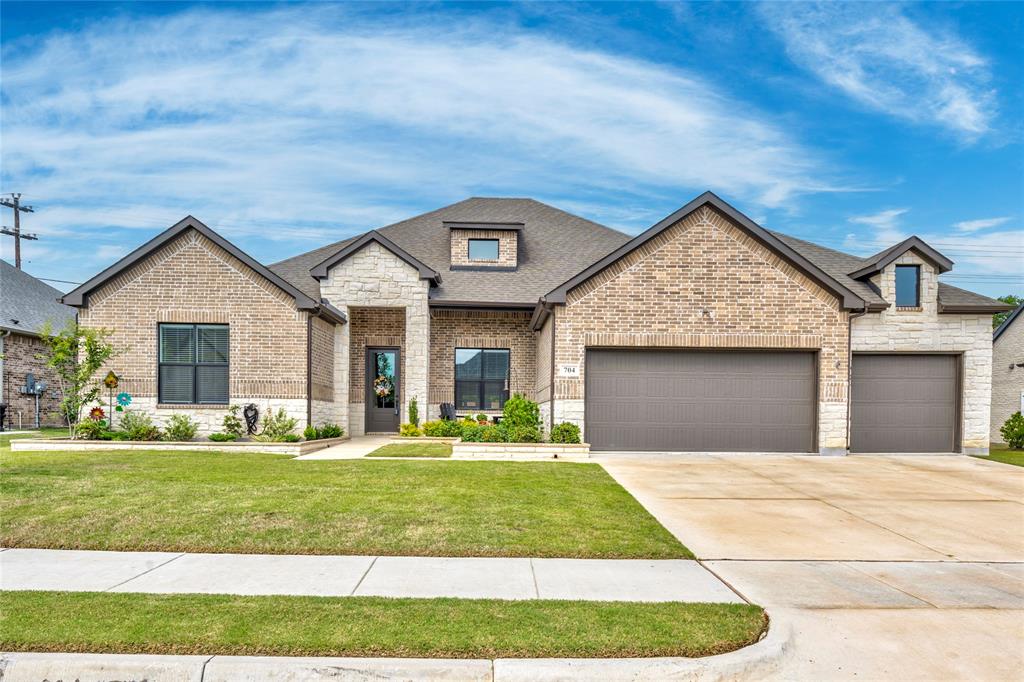 704 Abbey Road Van Alstyne, TX 75495 - Photo 1 of 38 a front view of a house with a yard