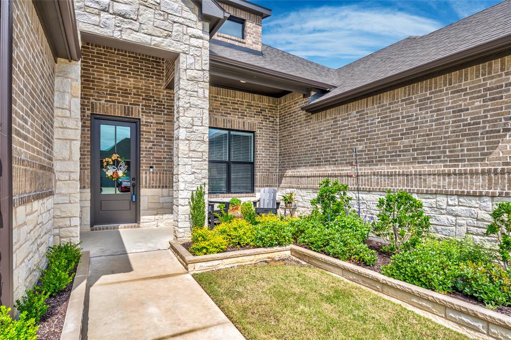 704 Abbey Road Van Alstyne, TX 75495 - Photo 2 of 38 a view of a backyard with plants