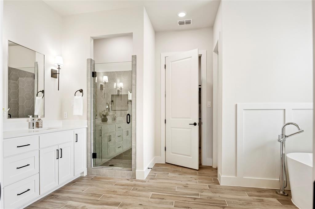 704 Abbey Road Van Alstyne, TX 75495 - Photo 23 of 38 a bathroom with a shower and a sink