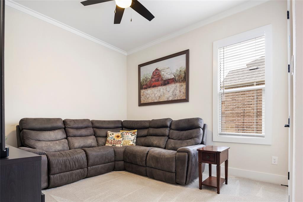 704 Abbey Road Van Alstyne, TX 75495 - Photo 26 of 38 a living room with furniture a couch and a window