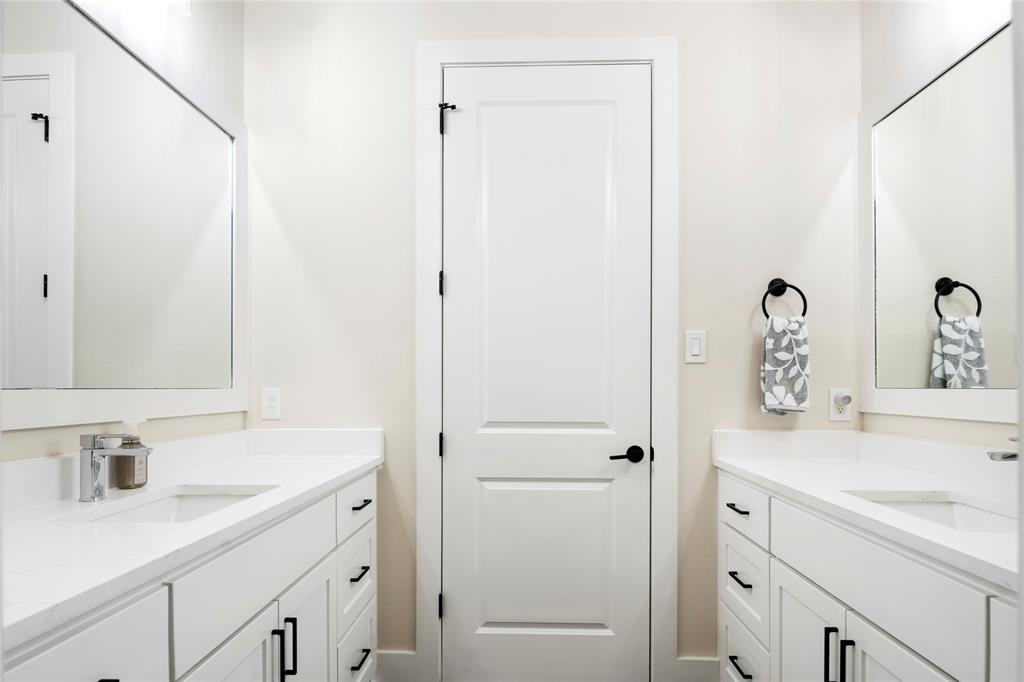 704 Abbey Road Van Alstyne, TX 75495 - Photo 27 of 38 a bathroom with a sink and a mirror