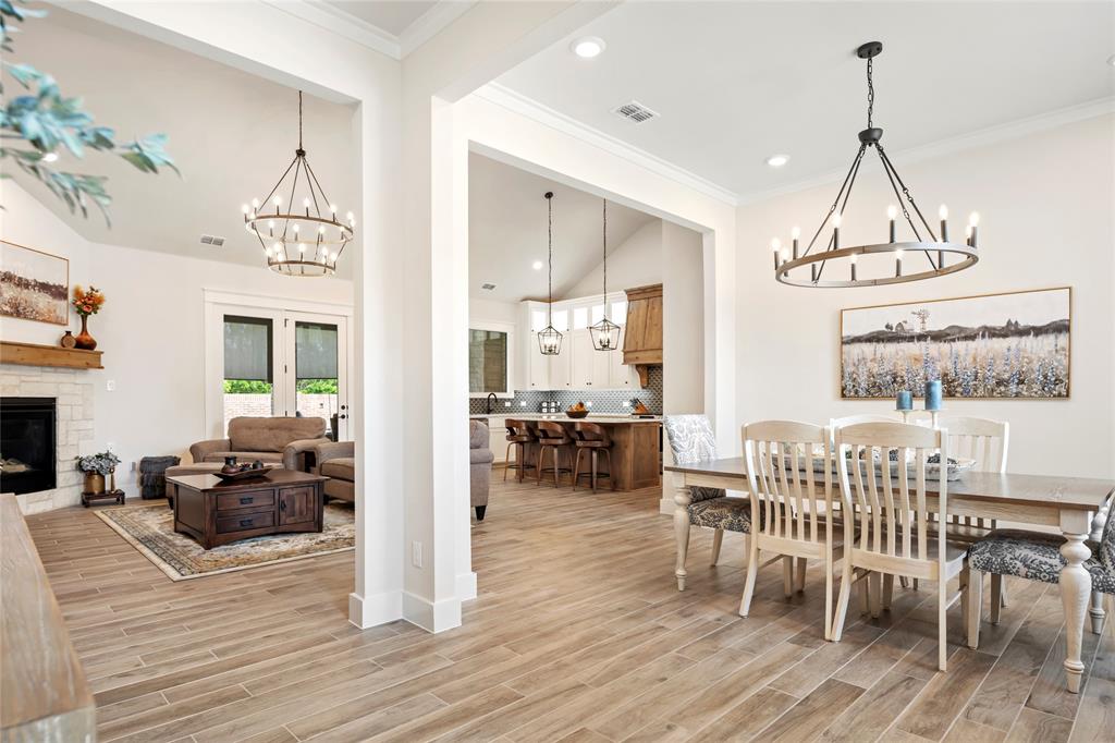 704 Abbey Road Van Alstyne, TX 75495 - Photo 3 of 38 a view of a dining room with furniture window and wooden floor