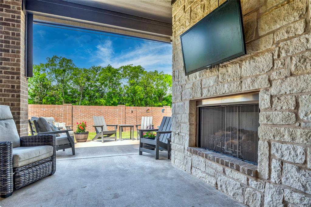 704 Abbey Road Van Alstyne, TX 75495 - Photo 36 of 38 a view of an outdoor kitchen and dining space