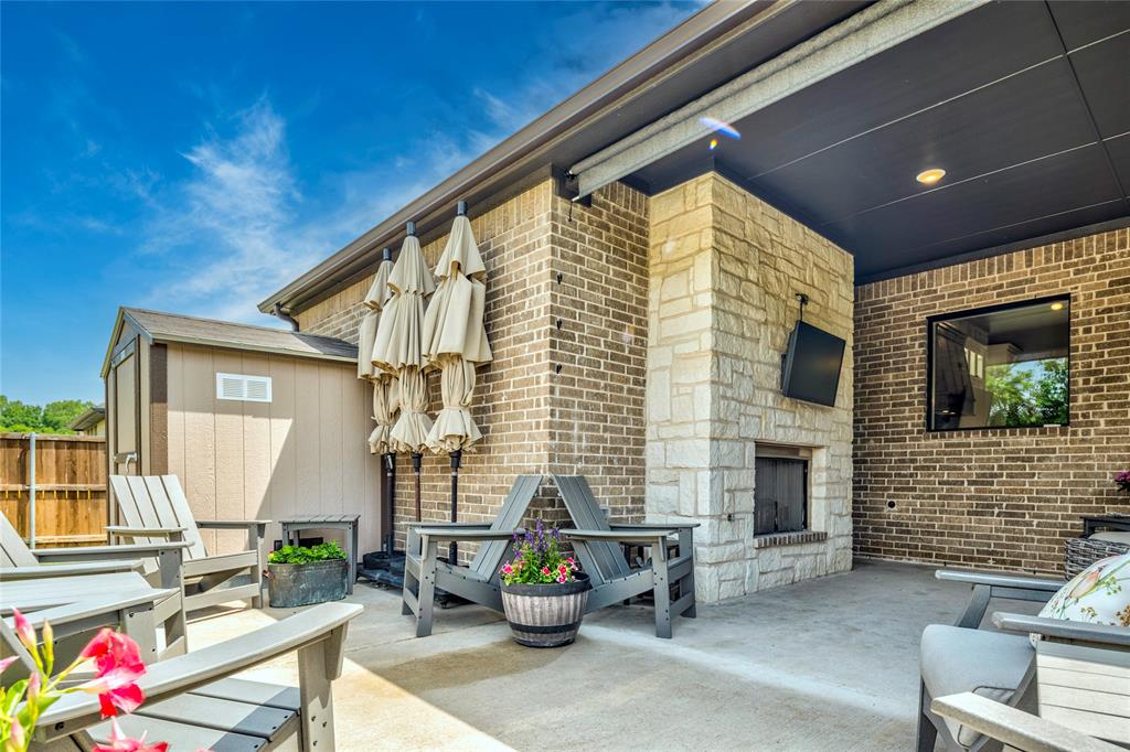 704 Abbey Road Van Alstyne, TX 75495 - Photo 37 of 38 a backyard of a house with outdoor seating