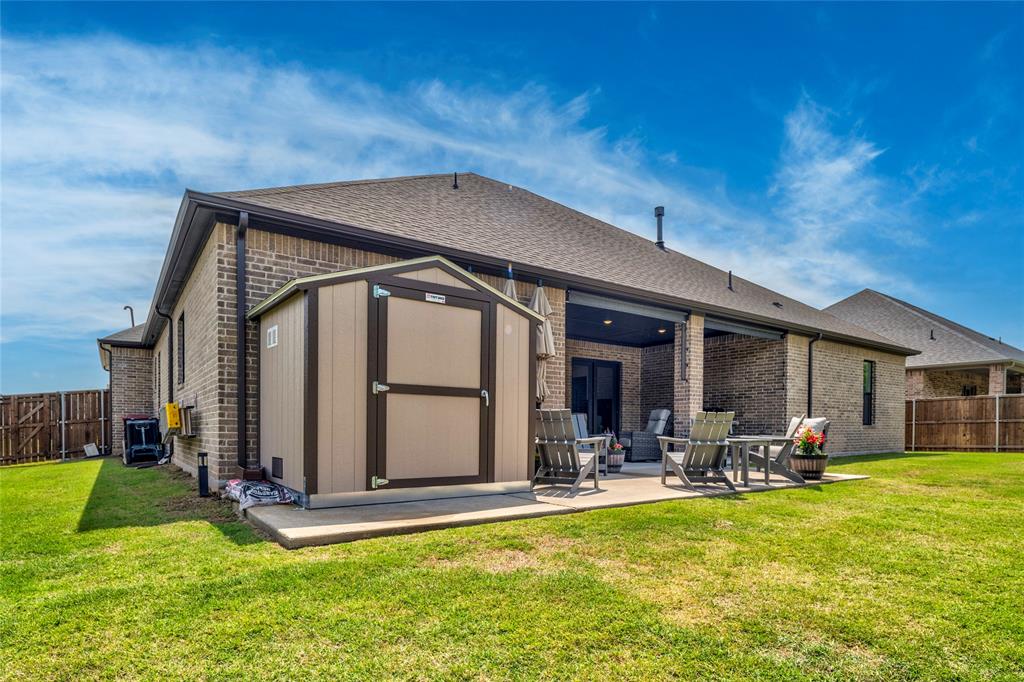 704 Abbey Road Van Alstyne, TX 75495 - Photo 38 of 38 a view of a house with swimming pool and chairs